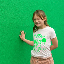 Load image into Gallery viewer, Girl wearing her own drawing on her t-shirt at the towner gallery