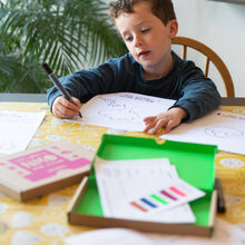 Load image into Gallery viewer, Boy drawing his t-shirt design