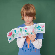 Load image into Gallery viewer, Learning about different leaf shapes using our pocket field guide to being a Dendrologist