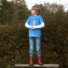 Load image into Gallery viewer, Bot standing on a bench wearing leaf design t-shirt. learning about leaf shapes